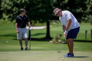 Two Golfers on a Putting Green